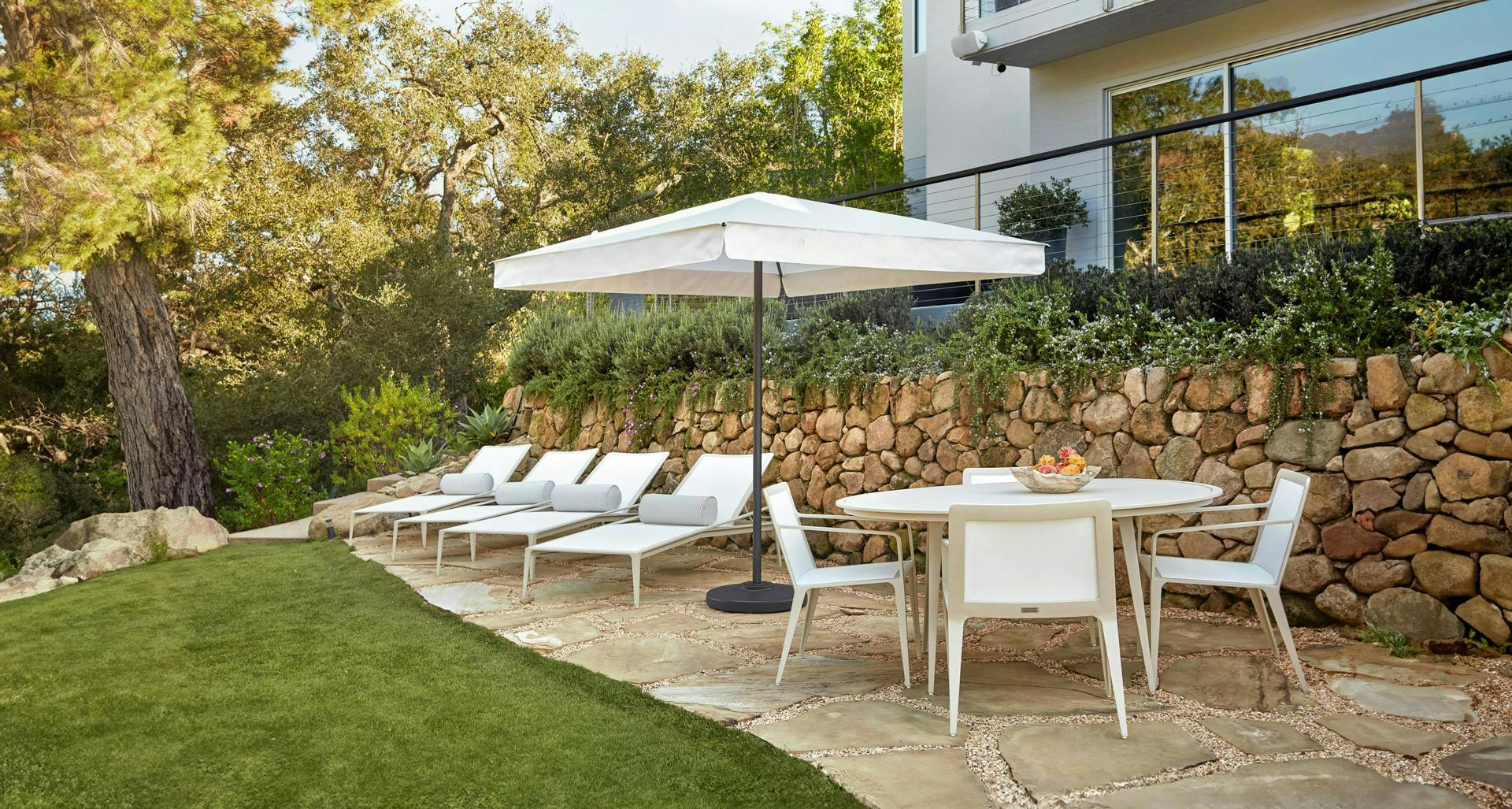 Still dining set and chaise lounge with pillows with summit square umbrella